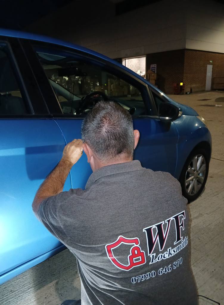 Warren working on a vehicle lock